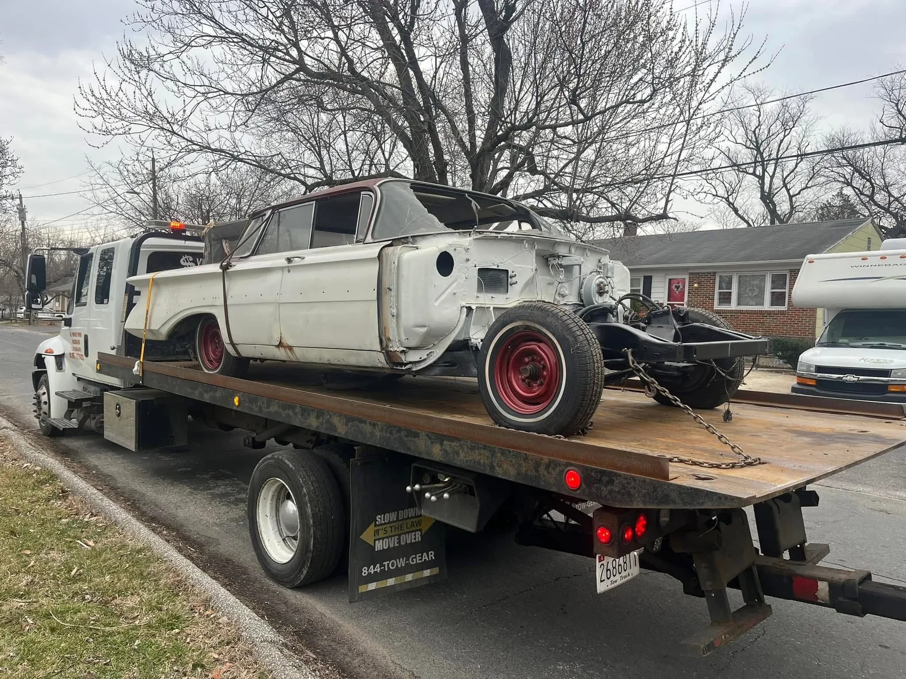 Statewide Recovery Service flatbed transporting a classic vehicle project