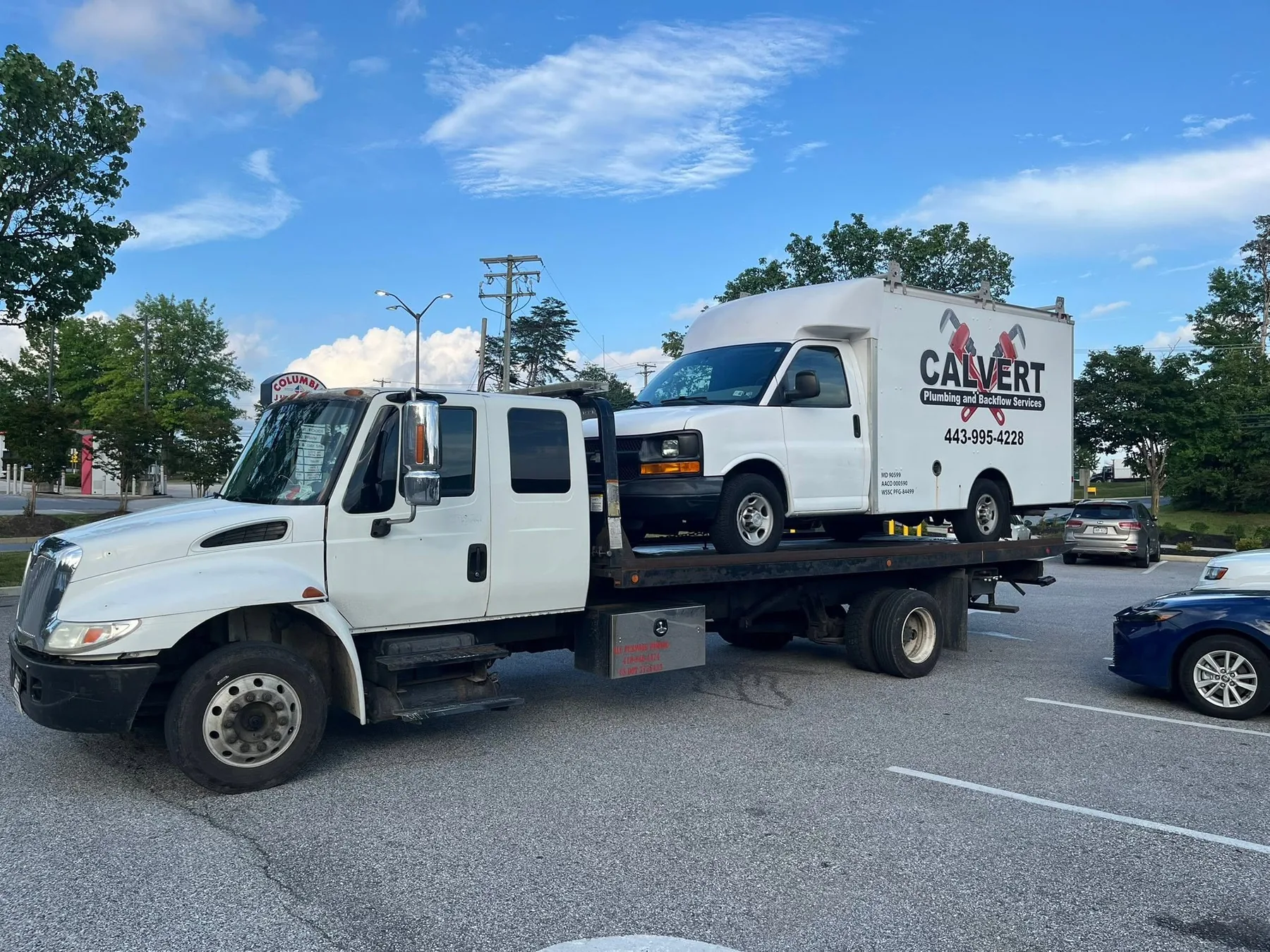Statewide Recovery Service flatbed transporting a commercial van